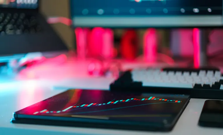 Multiple AI tool interfaces on laptop and desktop screens