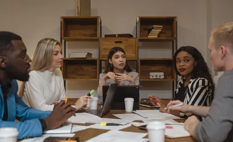 Multicultural professionals discussing strategy in modern office